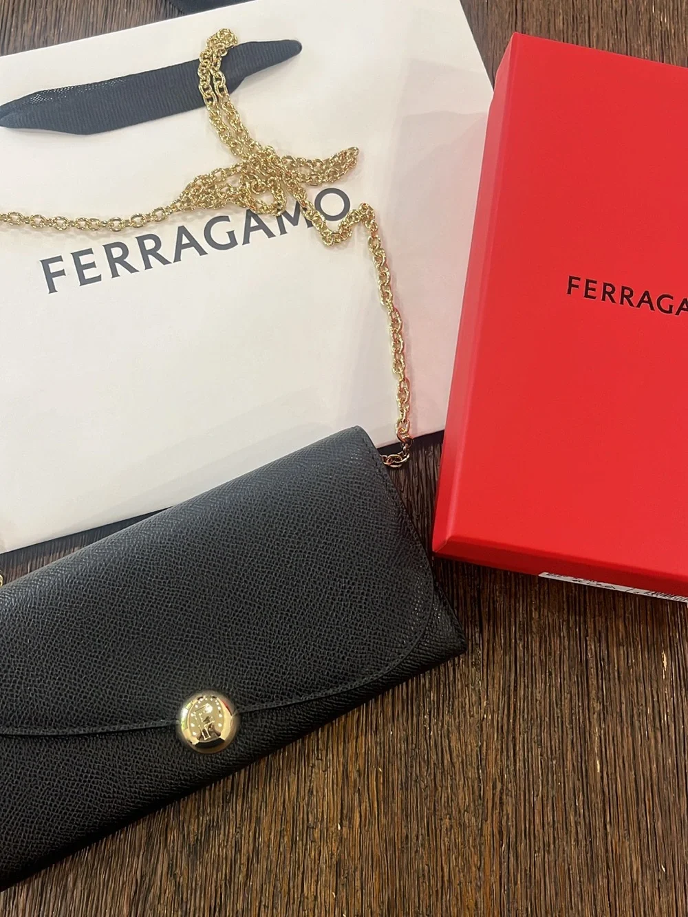 Salvatore Ferragamo Black Leather Clutch with Gold Chain and Button new with tag